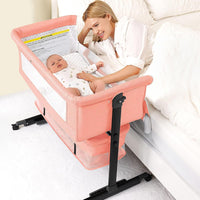kmaier Foldable Portable Baby Bassinet Bedside Crib with Adjustable Height, Wheels, and Storage Basket,Pink
