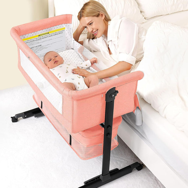 kmaier Foldable Portable Baby Bassinet Bedside Crib with Adjustable Height, Wheels, and Storage Basket,Pink